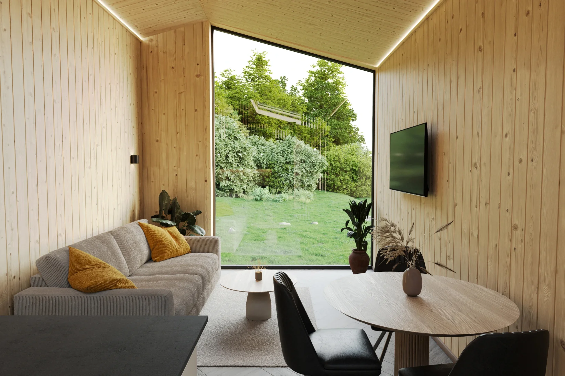 Wohnraum mit Sofa, Esstisch und Holzwänden, grosses Fenster zum Garten